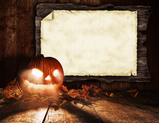 Scary halloween pumpkin with blank board