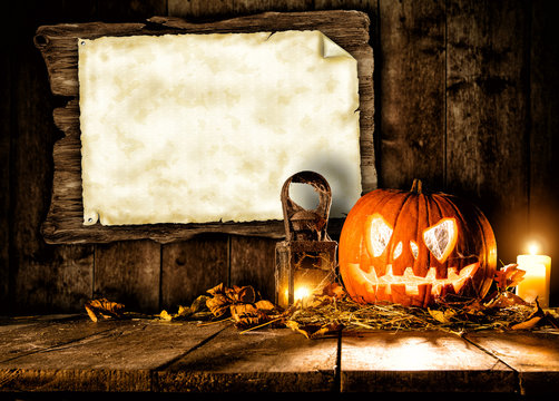 Scary halloween pumpkin with blank board