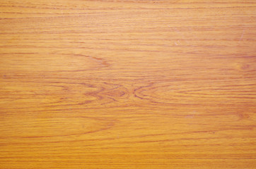 Texture of the orange wood as background