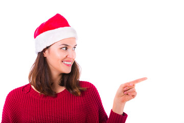 Christmas girl with Santa Claus clothes point to blank space isolated on white background