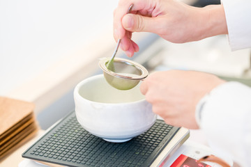 Fototapeta na wymiar Japanese tea ceremony - tea container and cup 