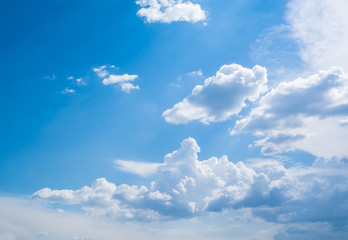 Blue sky with curly clouds