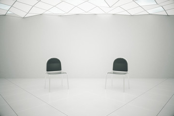 White interior with two chairs