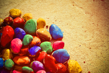 stones with a smooth surface painted with multicolored paint close-up