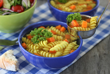 A bright delicious vegetable salad and pasta with vegetables