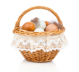fresh eggs in a basket, on a white background