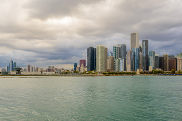 Chicago skyline with skyscrapers viewed over lake.