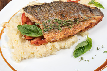 Fried fish dorado and couscous