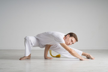Fototapeta na wymiar Young man doing stretching exercises