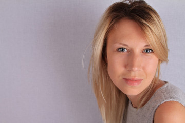 Beautiful smiling happy 30 year old woman portrait. Hair with balayage highlights