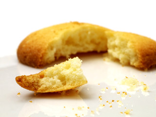 closeup of broken cookie on white plate, shallow depth of field