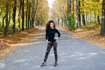 Fototapeta premium pretty woman in autumn forest