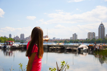 Fototapeta premium cute girl near bay water