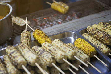Many roasted corn or Grilled corn cob at  market in Thailand,street food,filtered image,light effect added,selective focus