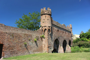 Medieval rampart with towers spanning a river