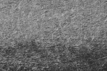 Black and white image with pattern that made by scrape. Scratched background.
