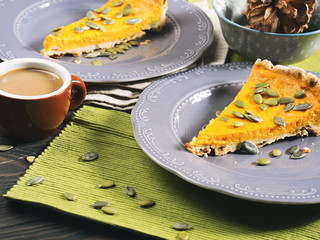 Slice of pumpkin pie and coffee