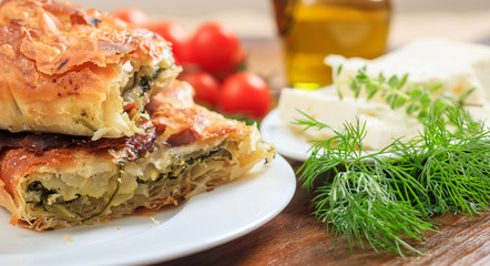 Spinach pie pieces on a table