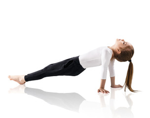 Little girl doing yoga exercises