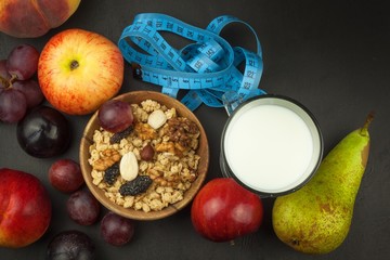Oatmeal, fruit and a glass of milk. Diet food. Nutritious food for athletes. Healthy diet. Traditional breakfast.

