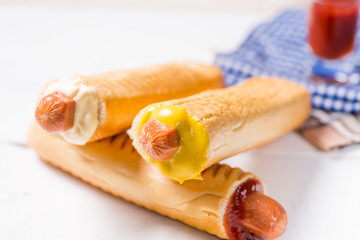European hot dogs with different sauces