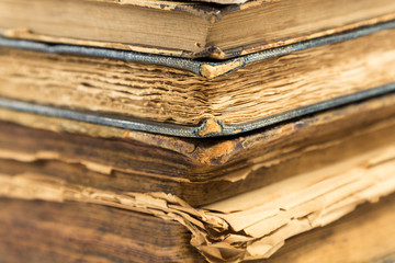 Vintage, old, antiquarian books pile close up.