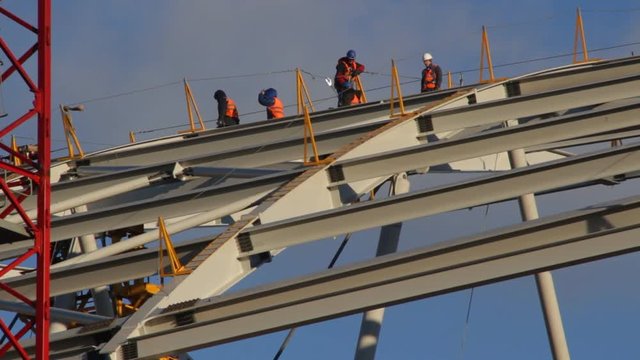 High rigger workers on stadium construction
