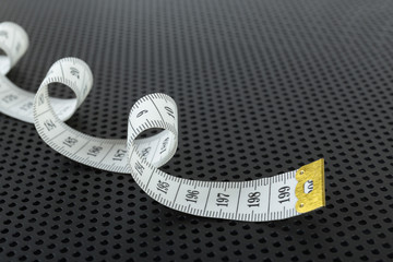 Curved white measuring tape