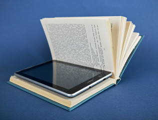 Modern ebook reader in traditional book