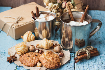 Metal mugs with cacao and marshmallow