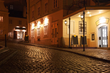 Illuminated cobbled street by late  evening , Vienna , Austria. © Antonel