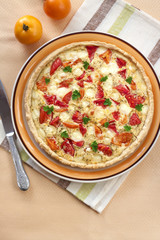 Tart with salted sheep cheese and tomatoes