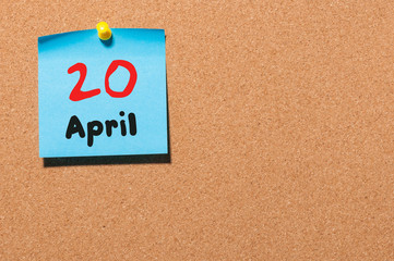 April 20th. Day 20 of month, calendar on cork notice board, business background. Spring time, empty...
