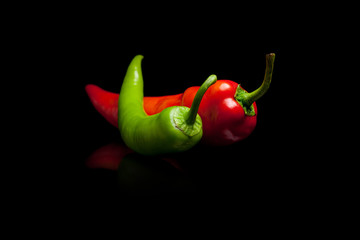 Red and green pepper black background
