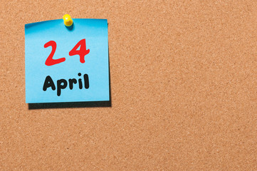 April 24th. Day 24 of month, calendar on cork notice board, business background. Spring time, empty...
