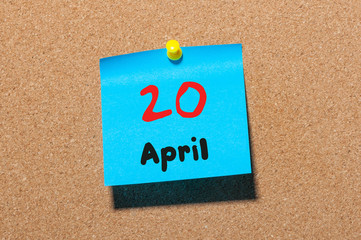 April 20th. Day 20 of month, calendar on cork notice board, business background. Spring time, empty...