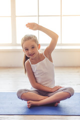 Naklejka premium Little girl doing sport