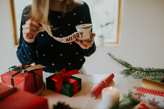 Woman Wrapping Christmas Gifts