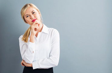 Young businesswoman in a thoughtful pose