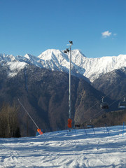 Ski resort in the Caucasian mountains, snow peaks, cable way