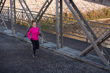 sporty woman jogging on morning