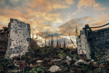 Destroyed building.The remains of destroyed houses at sunset