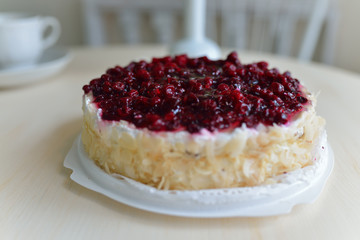 Delicious cake with berry filling on white background, shallow depth of field
