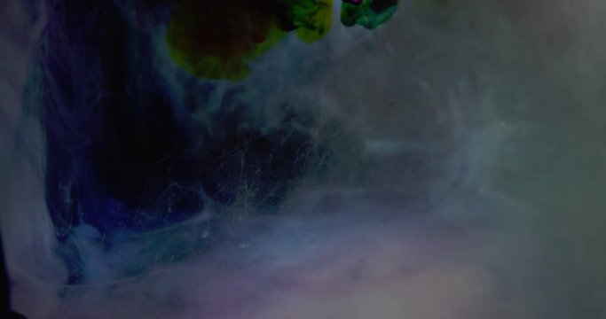 Creative Colorful Ink In Water. Multi colored ink in a mixture of colored water. Fantastic abstract texture, Filmed in 4K for super hi-def