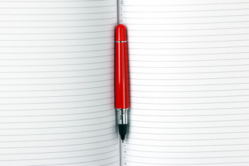 open notepad and red pen closeup