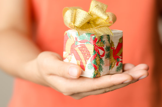 Gift box holding by hand for giving