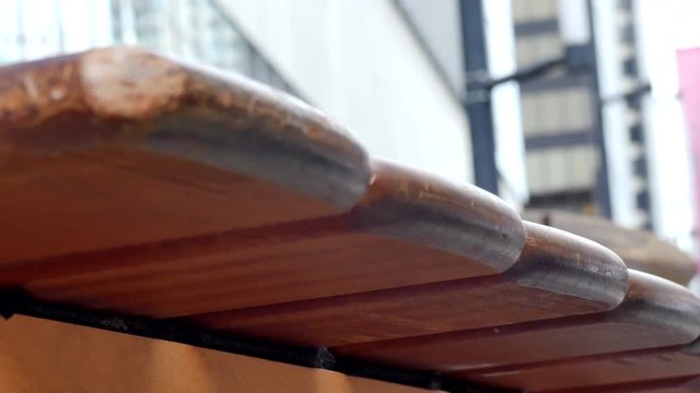 Low angle shot wooden xylophone hand