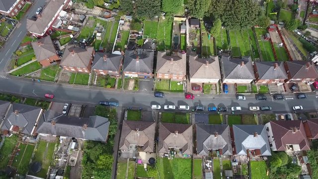 Aerial view of a housing estate in Dudley, West Midlands. Tilting up.