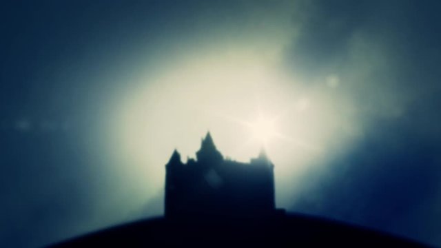 Spooky European castle on a hill in a Foggy Day