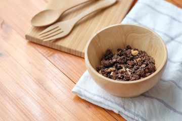 Morning granola breakfast with raisins and hazelnut